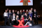 Zdjęcie grupowe uczestników Konferencji TEDxPolitechnika Gdańska 2025 na ściance zdjęciowej.
